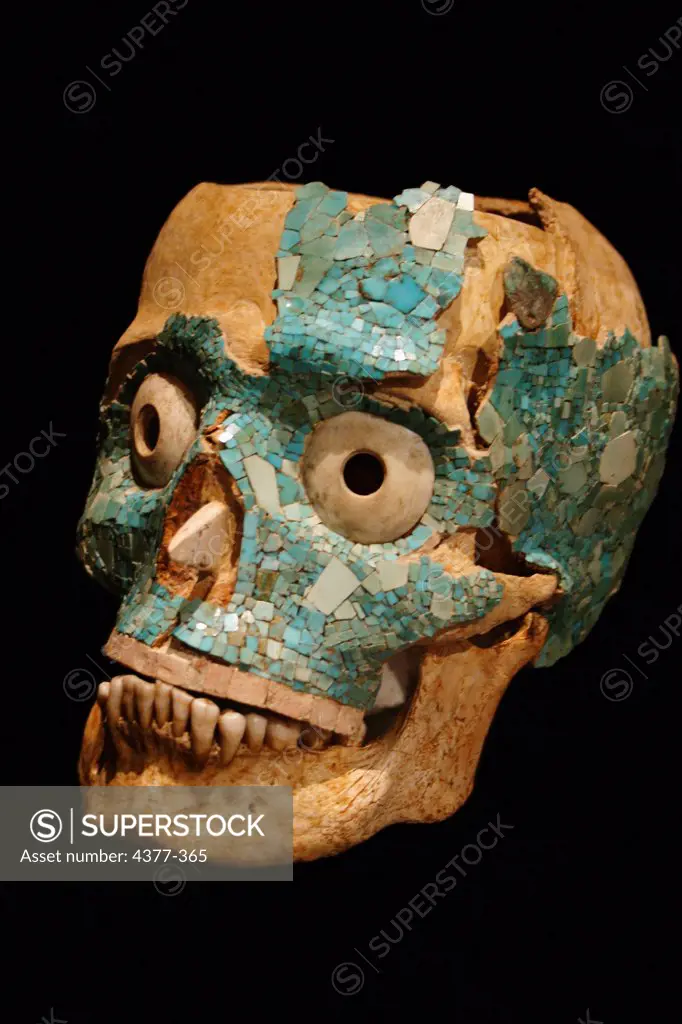 A human skull decorated in mosaic fashion with turquoise, found at the Zapotec/Mixtec ruins of Monte Alban near Oaxaca, Mexico dates back to 600-900 C.E.