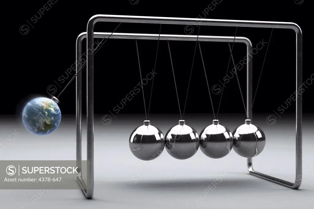 Conceptual illustration close-up of a Newton's cradle where one of the spheres has been replaced by an earth.