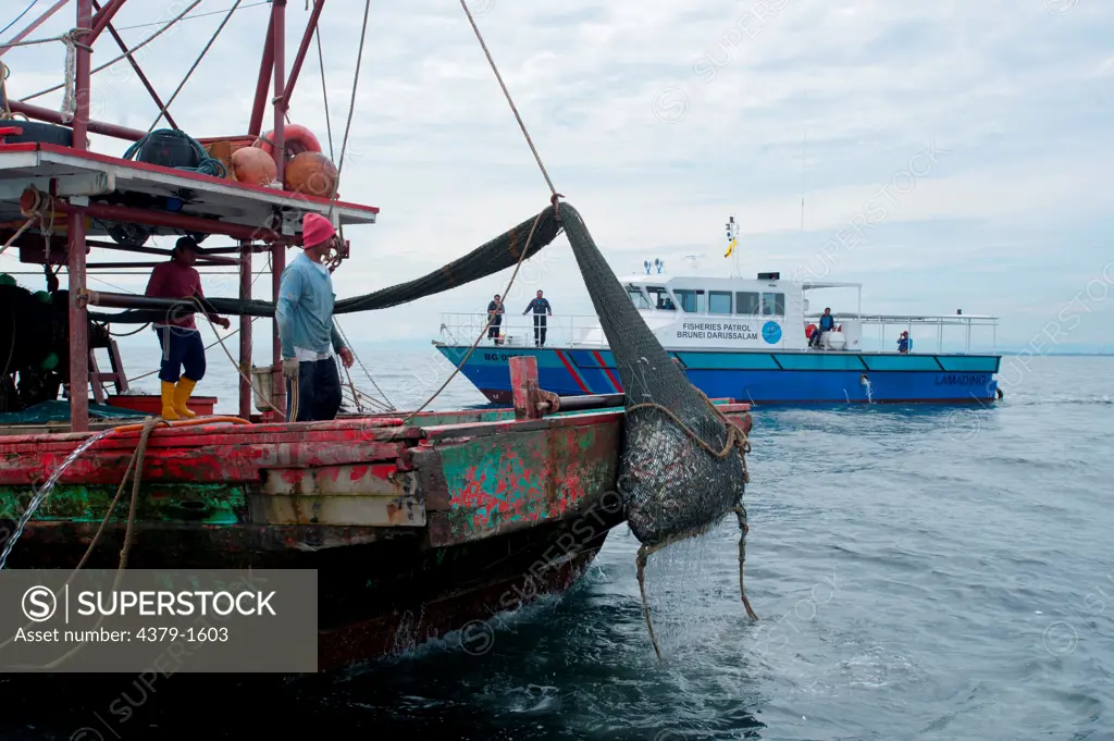 Fisheries patrol coming across a fishing trawler, Brunei