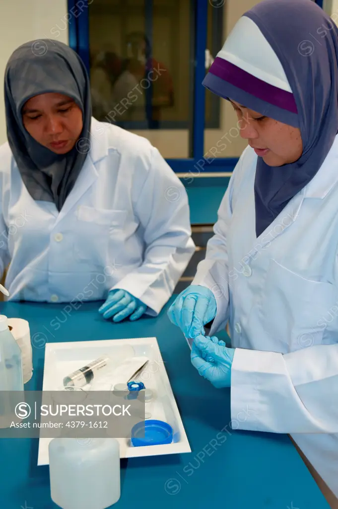 Scientists analyzing the water samples taken at sea, Brunei