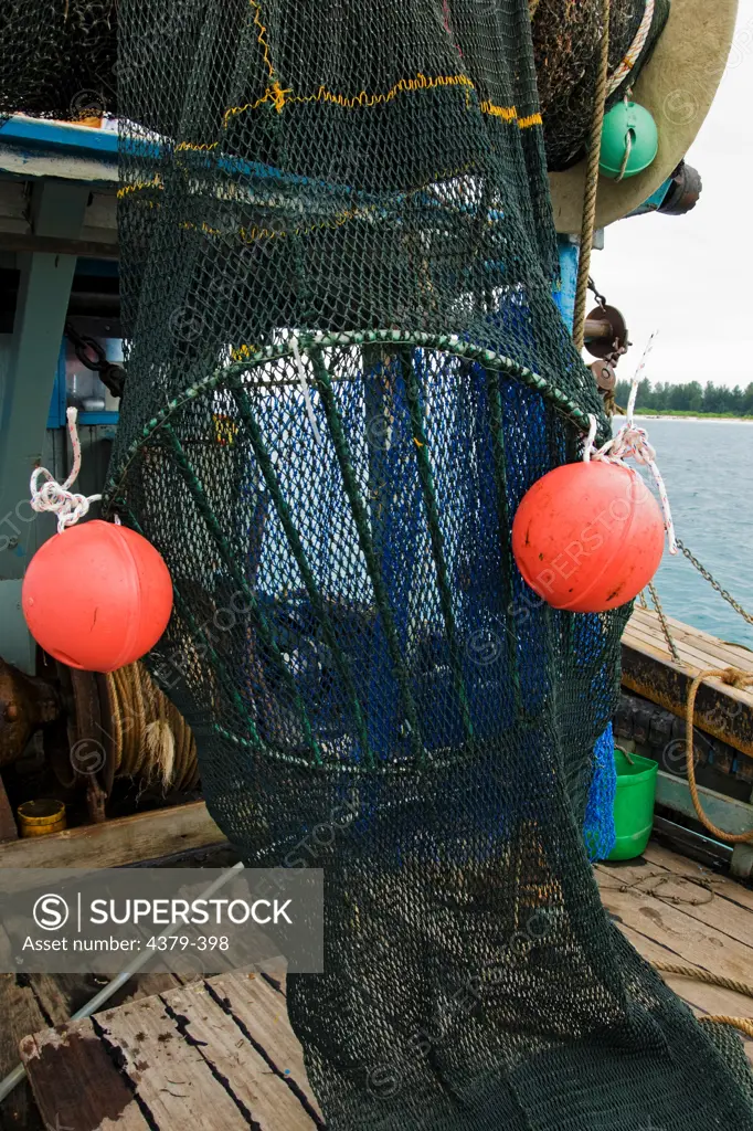 A trawl net with a turtle exclusion device in place. The device allows captured sea turtles to escape the net.