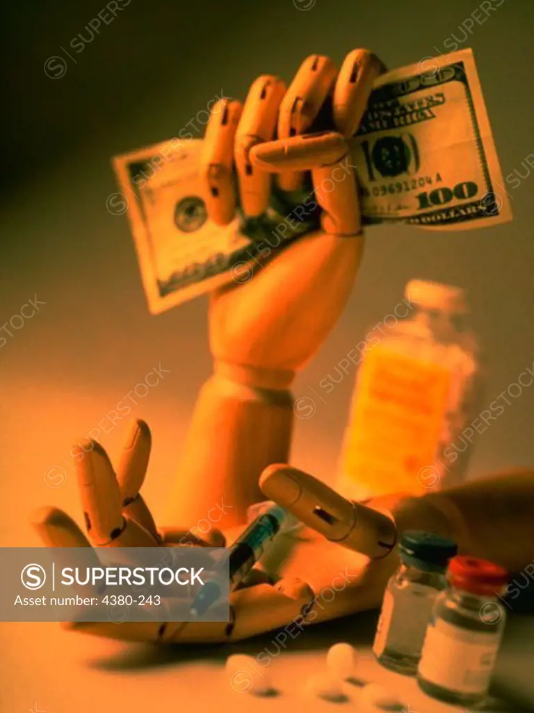 Medical Still Life with Hand Holding Money, Syringe, and Pills