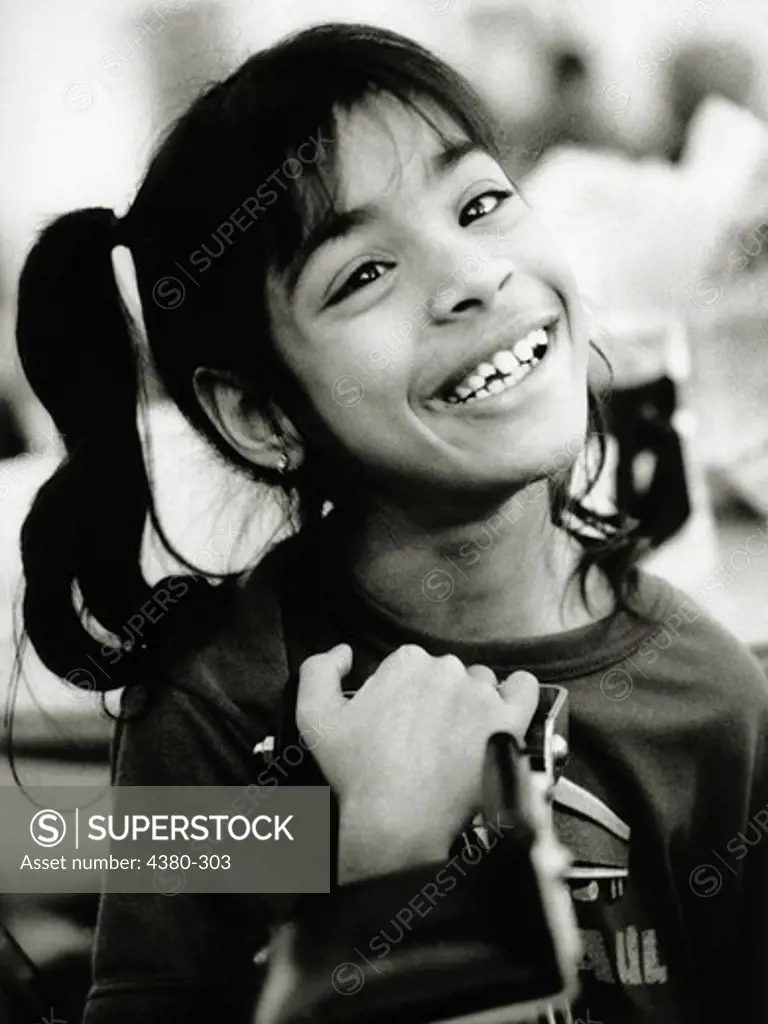 Portrait of Smiling 11-Year-Old Girl with Cerebral Palsy