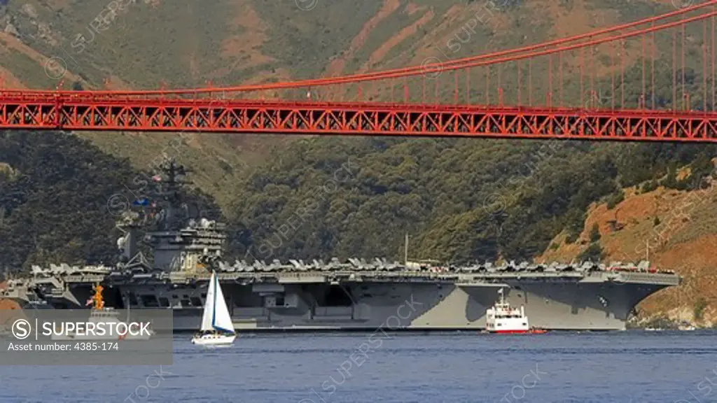 Aircraft Carrier Passing Under Golden Gate Bridge