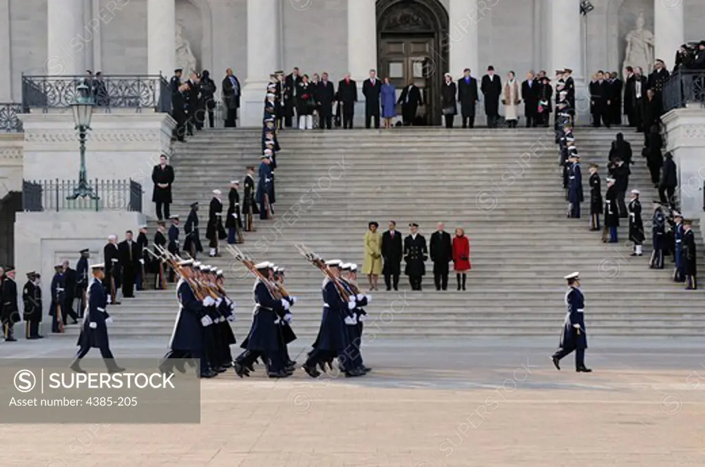 The U.S. Coast Guard Ceremonial Honor Guard passes in review at the east front of the U.S. Capitol, Washington, D.C., on Jan. 20. 2009.  The unit is part of the escort that will see the new president to the Executive Mansion, carrying forward a tradition that began with the first inauguration, that for George Washington, in 1989.  More than 5,000 men and women in uniform are providing military ceremonial support to the presidential inauguration, one of the best attended in history.  (Photo by Pu