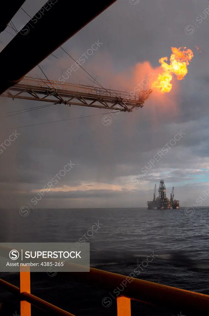 GULF of MEXICO - Gas from the damaged Deepwater Horizon wellhead is burned by the drillship Discoverer Enterprise May 16, 2010, in a process known as flaring.  Gas and oil from the wellhead are being brought to the surface via a tube that was placed inside the damaged pipe.