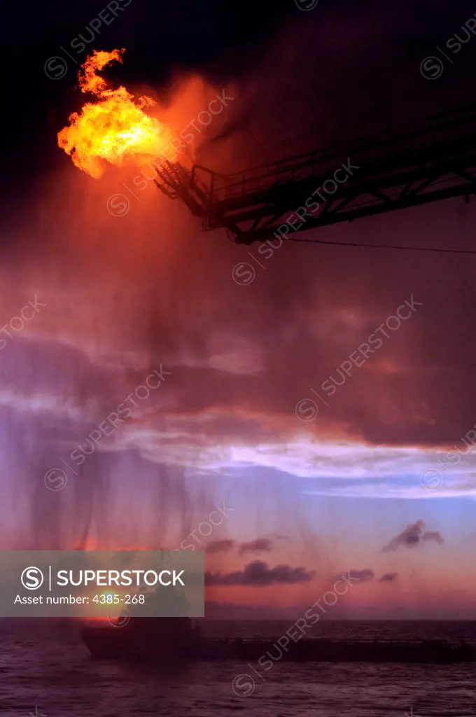 GULF of MEXICO - Gas from the damaged Deepwater Horizon wellhead is burned by the drillship Discoverer Enterprise May 16, 2010, in a process known as flaring.  Gas and oil from the wellhead are being brought to the surface via a tube that was placed inside the damaged pipe.