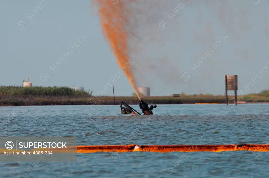 LAFITTE, La. - Oil and natural gas continue to spray from a damaged wellhead Friday, July 30, 2010, near the Barataria Waterway.