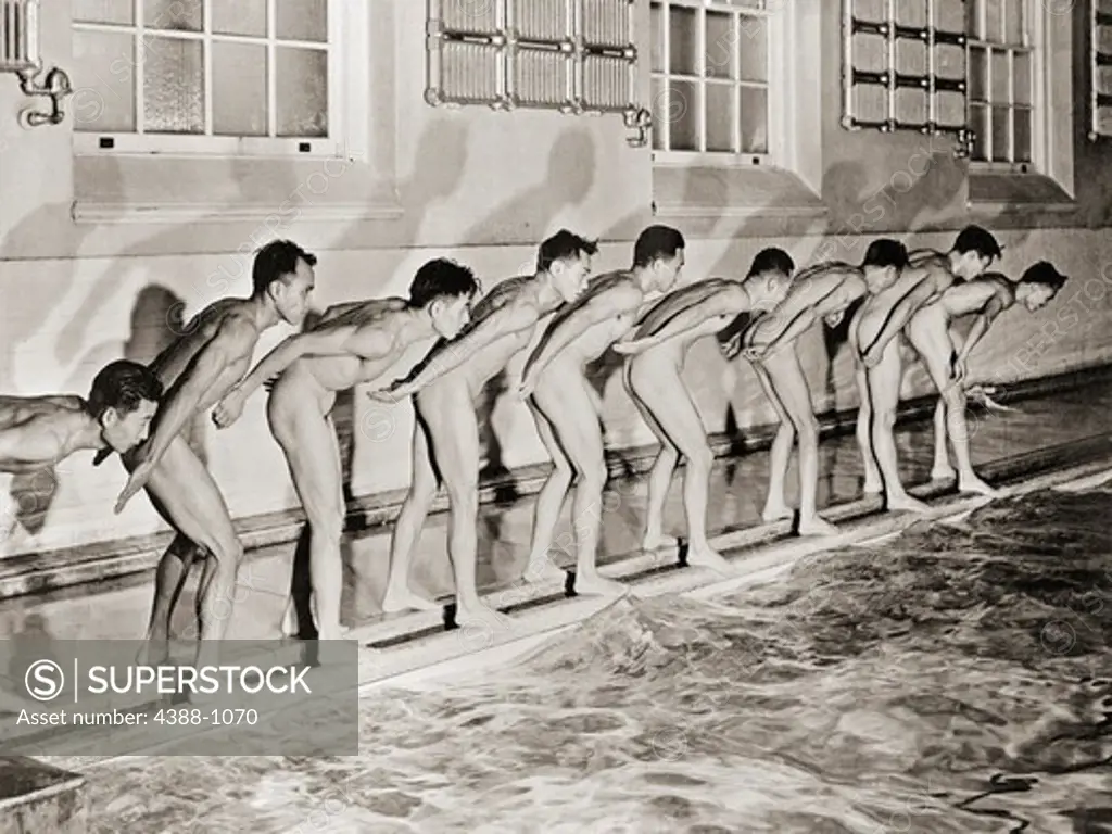 Nine Nude Men Prepare to Dive into Pool