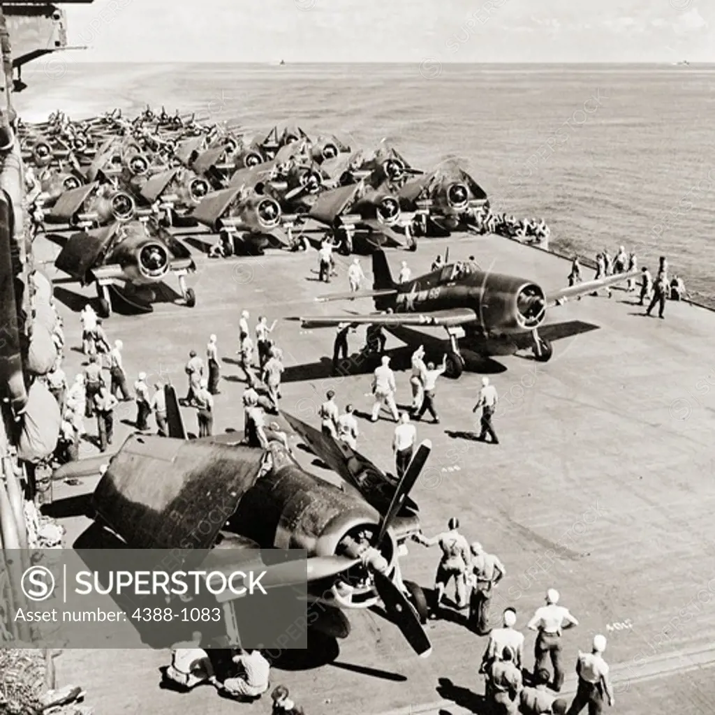 Crewmen Roll Out a Corsair for Take Off