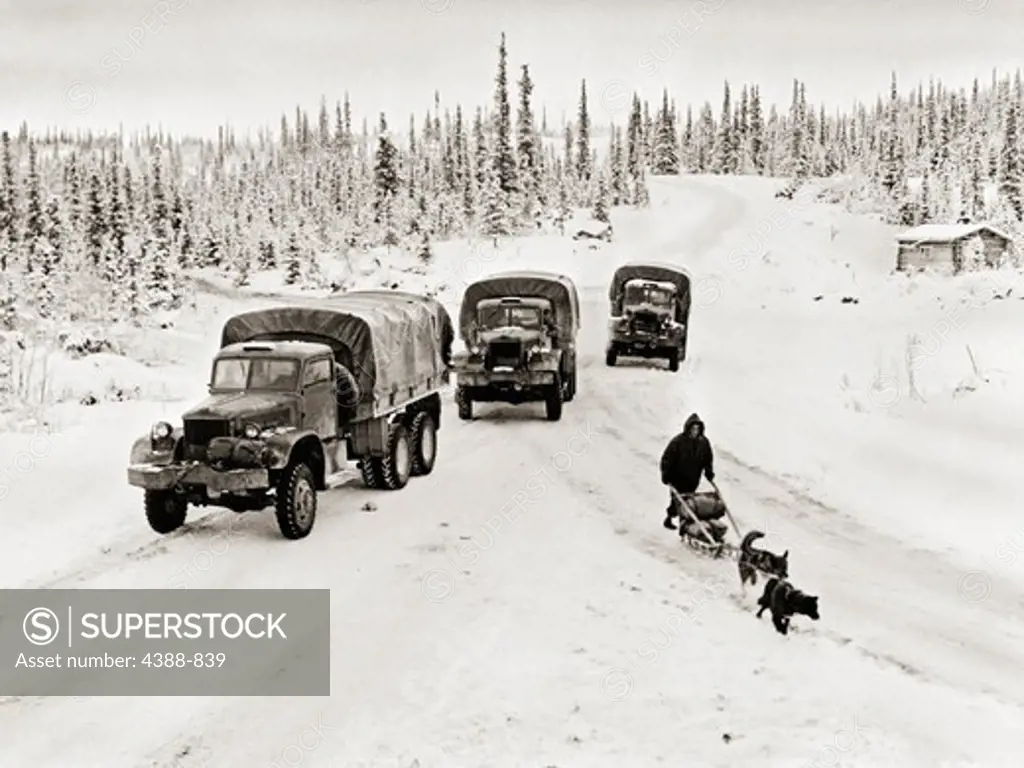 Trucks and Dogsled on ALCAN