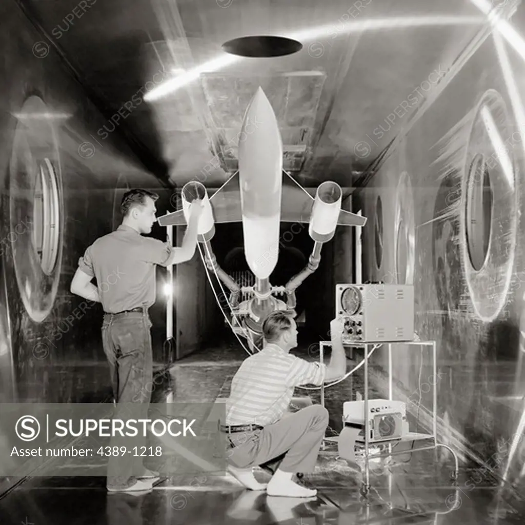 Engineers Check Model in Wind Tunnel