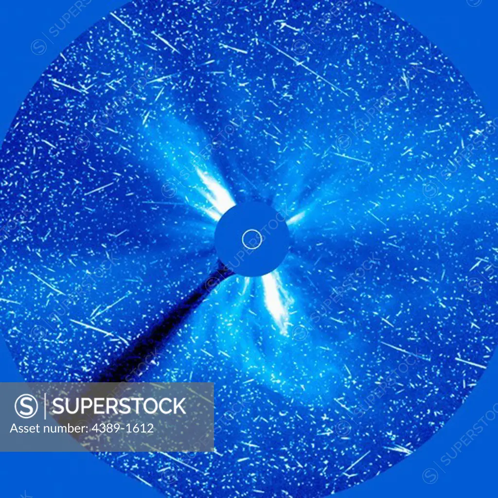 Early on April 21, 2002, a large (X-1) flare and a partial halo coronal mass ejection (CME) exploded out from the Sun from near its west (right) limb. A pronounced proton storm of high-energy particles took place at about the same time as seen in the LASCO (Large Angle and Spectrometric Coronagraph) C3 image taken in visible light from the Solar and Heliospheric Observatory (SOHO). The accompanying coronal mass ejection can also be seen in the image.