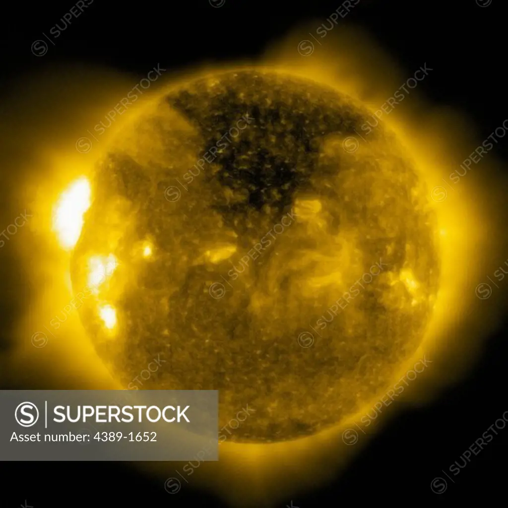 A large coronal hole appears dark (such as this area in the top part of the Sun) when viewed in extreme ultraviolet light at 284 angstroms, such as this image taken by the Solar and Heliospheric Observatory (SOHO)'s EIT (Extreme ultraviolet Imaging Telescope). Coronal holes are sources of solar wind.