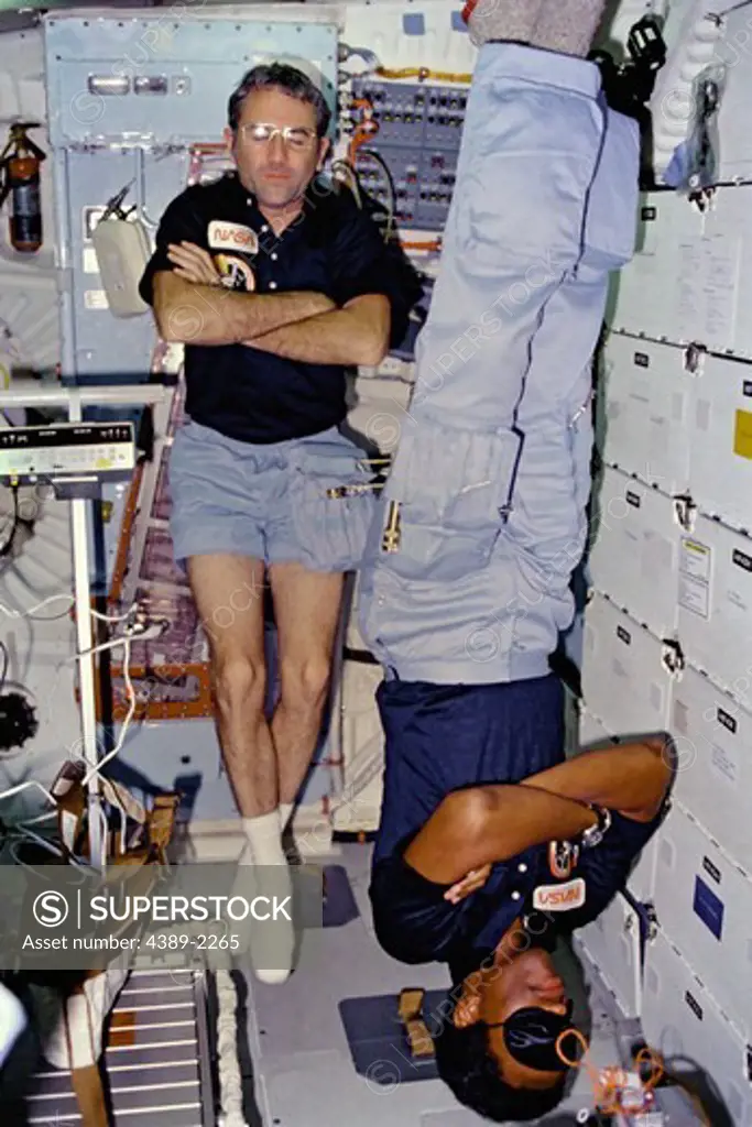 Astronauts Truly and Bluford Asleep on Middeck