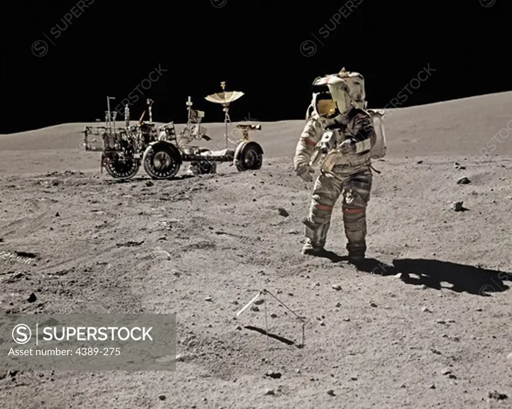 An Apollo 16 Astronaut Explores Near a Lunar Rover
