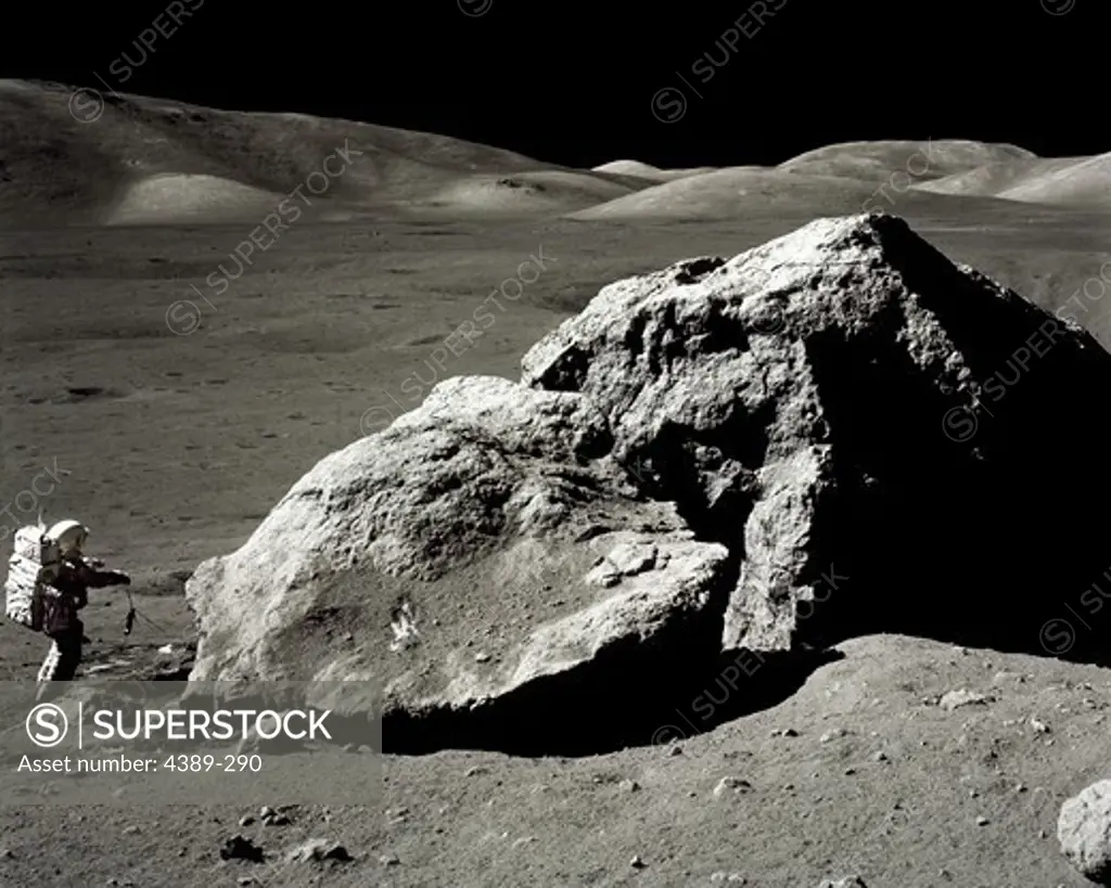 An Apollo 17 Astronaut is Dwarfed by a Moon Boulder