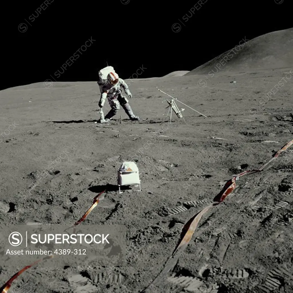 An Apollo 15 Astronaut Prepping Science Equipment on the Moon