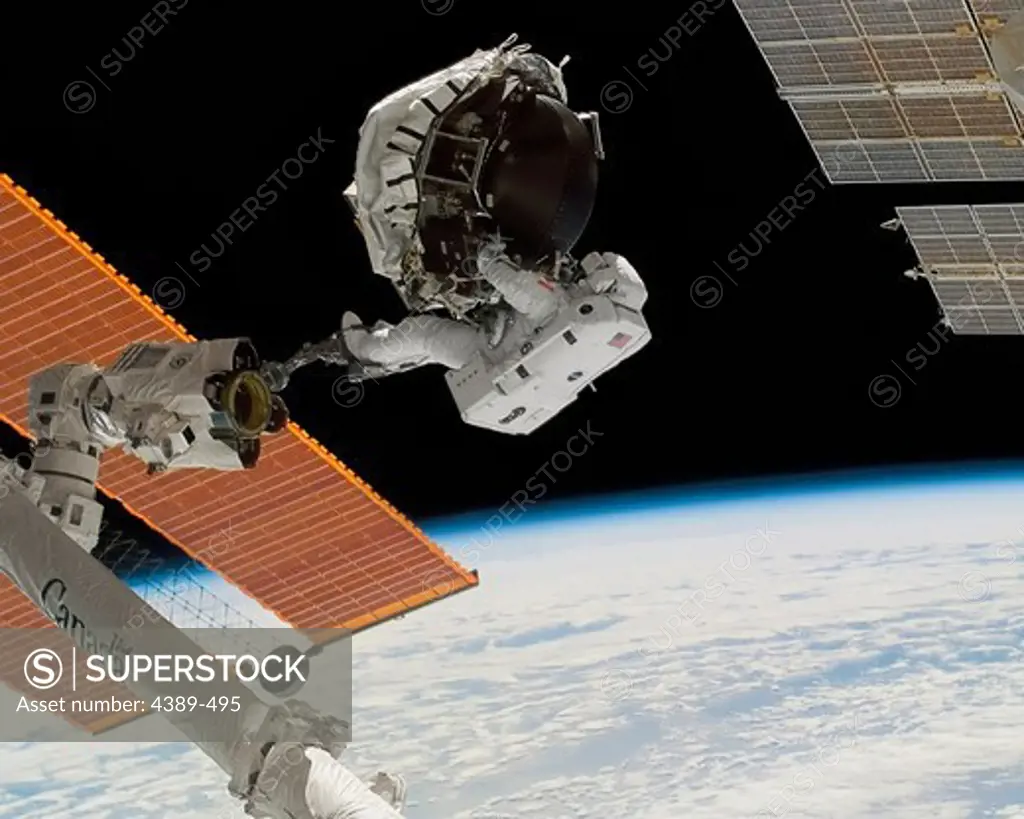 Astronaut Repairing Gyroscope on International Space Station
