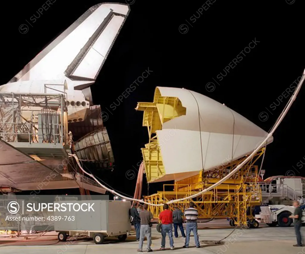 Attaching Tail Cone to Space Shuttle Discovery