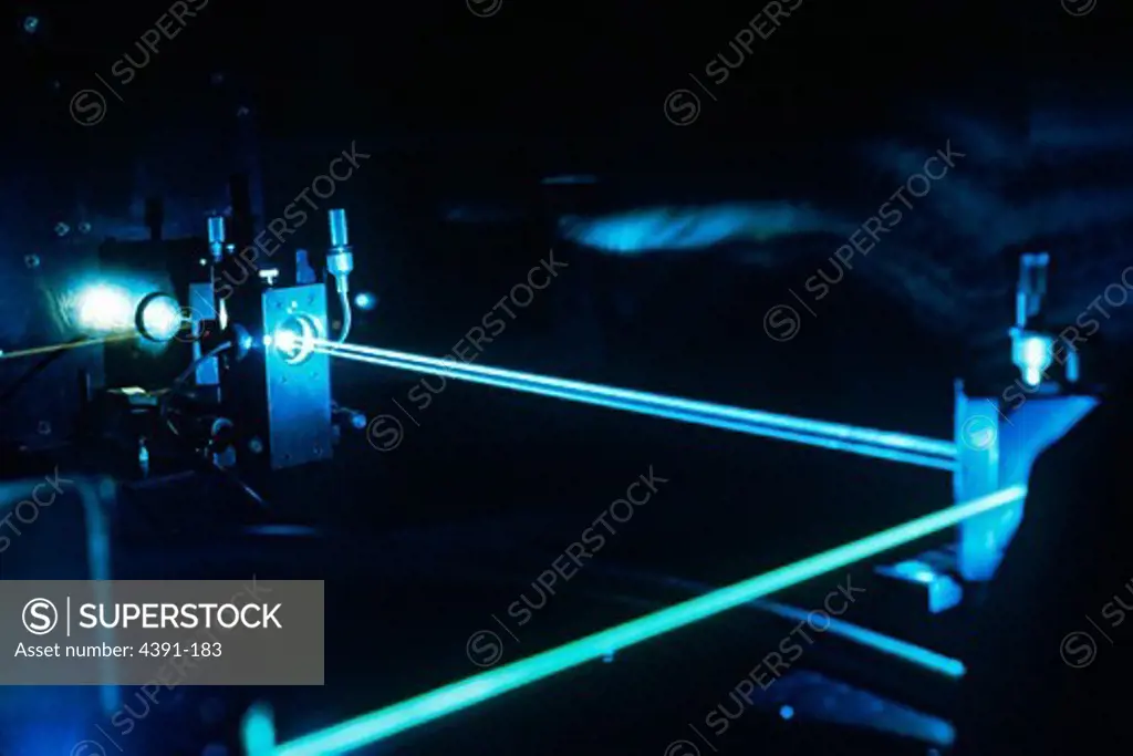 Photodynamic therapy (PDT) is a procedure to treat cancer. Patients are injected with a photosensitizer which is a light sensitive drug selectively retained by cancer cells. When exposed to laser light, the photosensitizer in the cancer cells produces a toxic reaction which destroys the tumor. This photo shows an argon-ion laser, the first component of the argon pumped-dye laser (630nm red). This argon-ion laser emits blue-green light at 488/514 nm, and is used to excite a dye in the second comp
