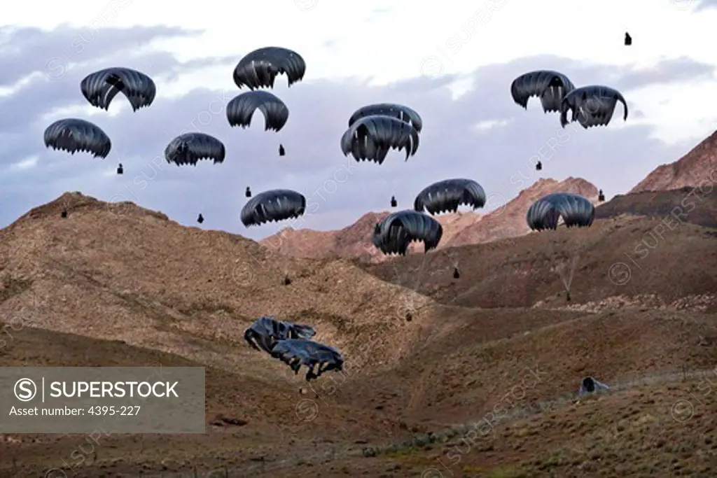 Twenty pallets of supplies float down over Forward Operating Base Baylough, Afghanistan for Red Tank, 1st Platoon, Delta Company, 1st Battalion 4th Infantry Regiment on June 13, 2010. The 1-4 IN Soldiers are deployed to Afghanistan in support of Operation Enduring Freedom.