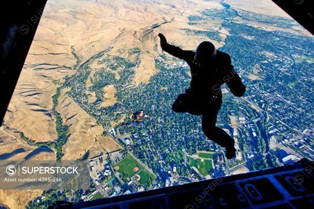 100825-N-0000W-002 BOISE, Idaho (Aug. 25, 2010) Members of the U.S. Navy parachute demonstration team, the Leap Frogs, jump out of a Kentucky Air National Guard C-130 H2 Hercules aircraft above the Idaho State Capitol during Boise Navy Week. Boise Navy Week is one of 20 Navy Weeks planned across America for 2010.