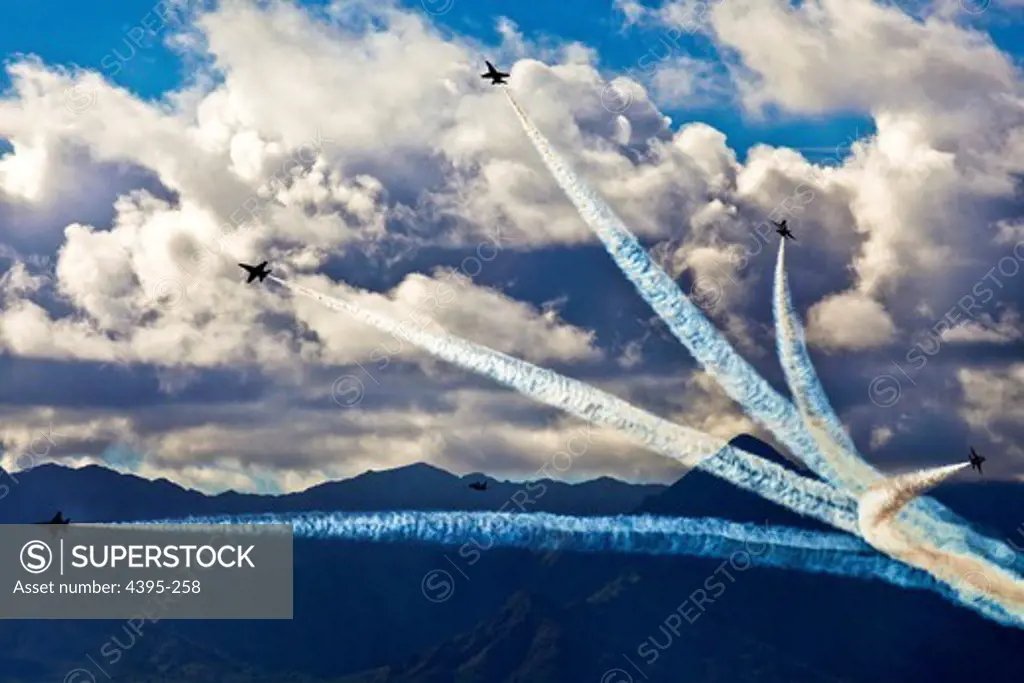 The Blue Angels perform aerobatic maneuvers for a crowd of military and civilians during the Kaneohe Bay Air Show at Marine Corps Air Station Kaneohe Bay on Marine Corps Base Hawaii.