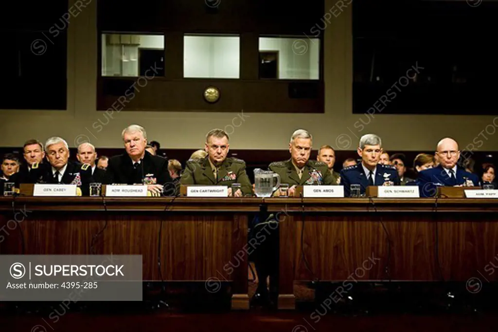 Army Chief of Staff Gen. George W. Casey Jr., Chief of Naval Operations Adm. Gary Roughead, Joint Chiefs Vice Chairman Marine Corps Gen. James Cartwright, Marine Corps Commandant Gen. James Amos, Air Force Chief of Staff Gen. Norton Schwartz, and Coast Guard Commandant Adm. Robert Papp Jr., testify on Capitol Hill in Washington Friday, Dec. 3, 2010, before the Senate Armed Service Committee's hearing on the military 'don't ask, don't tell' policy.