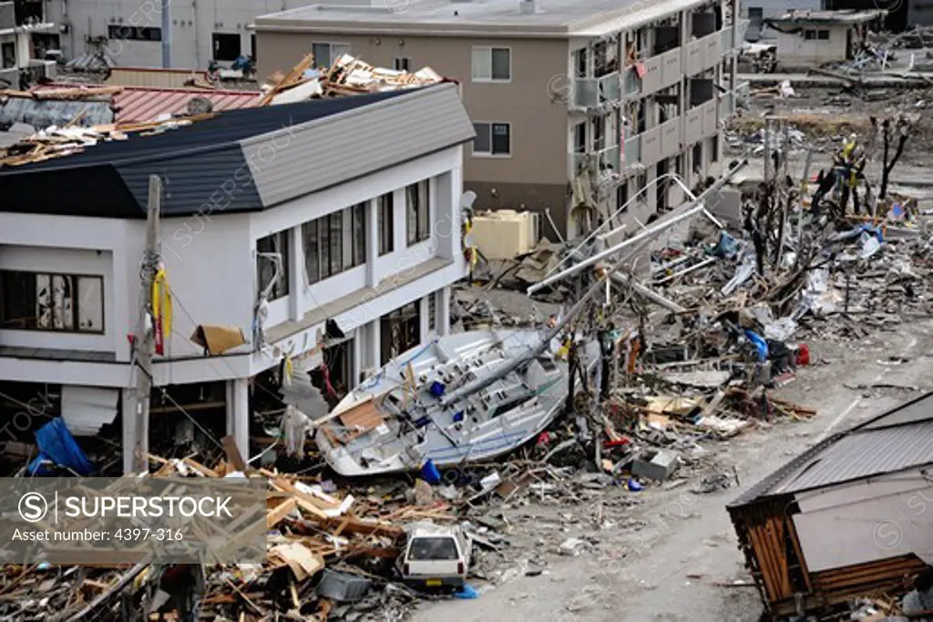 Sailboat Among Debris Following Earthquake and Tsunami