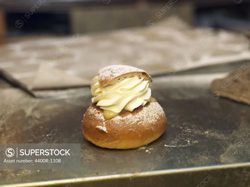Cream buns with almond paste on a baking plate, Sweden.