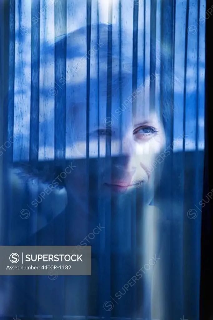 A woman by a window.