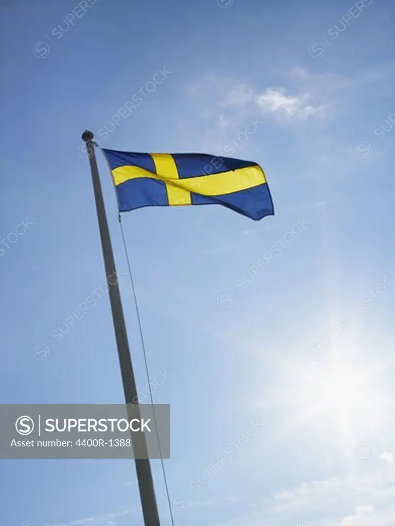 The Swedish flag and a blue sky, Sweden.