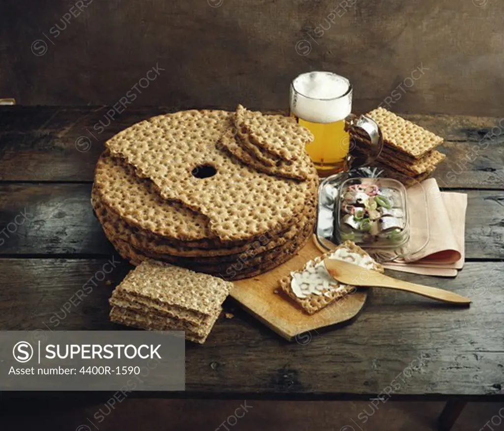 Crispbread, sweet-pickled herring and a glass of beer, Sweden.