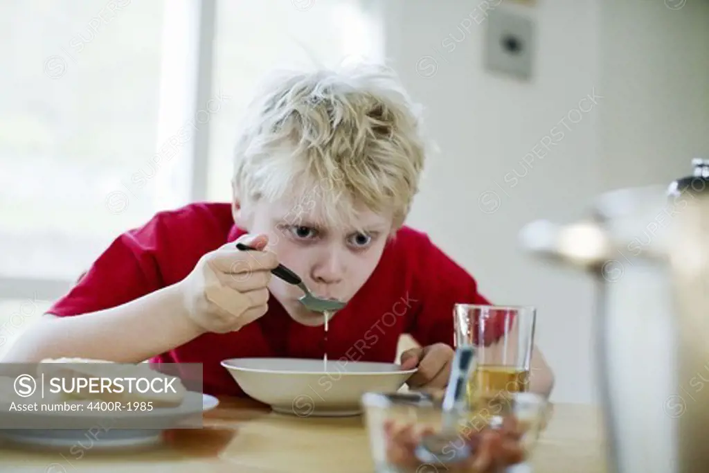 A boy having soup for dinner, Sweden.