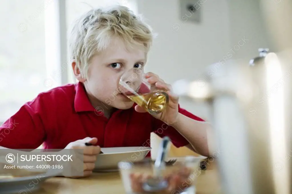 A boy having soup for dinner, Sweden.