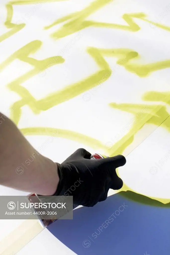A boy making a graffiti painting, Sweden.