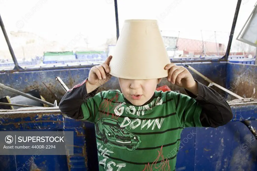 A boy with a lampshade on his head, Sweden.