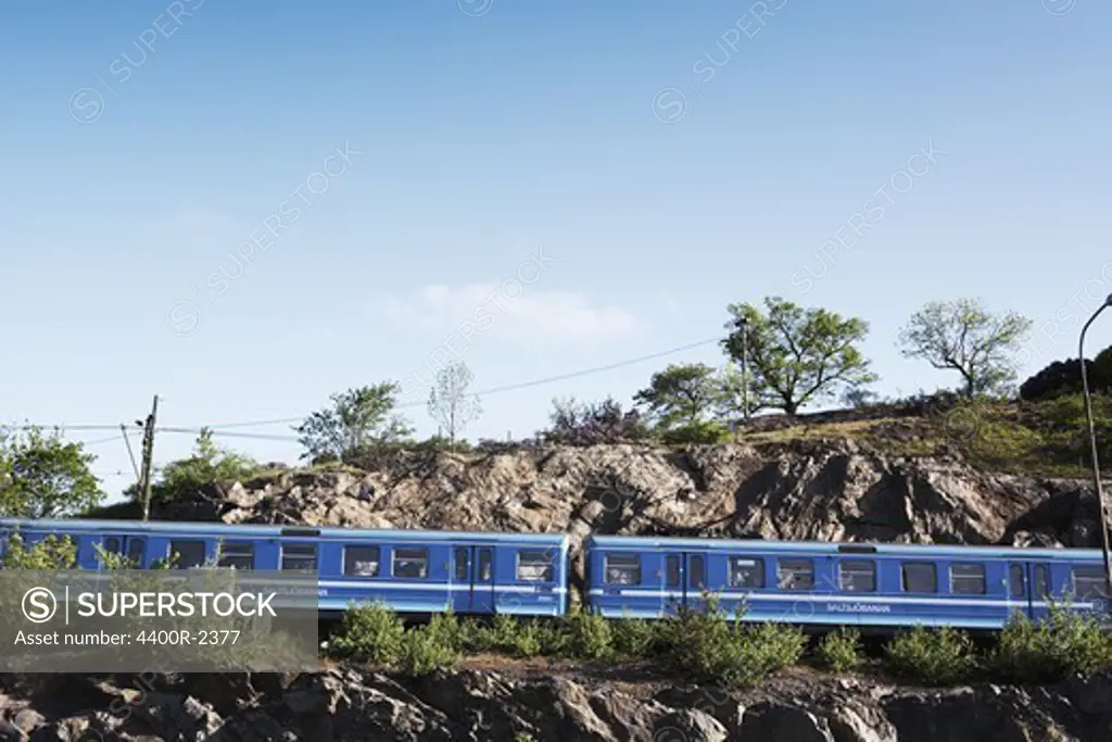 A train passing a mountain, Stockholm, Sweden.