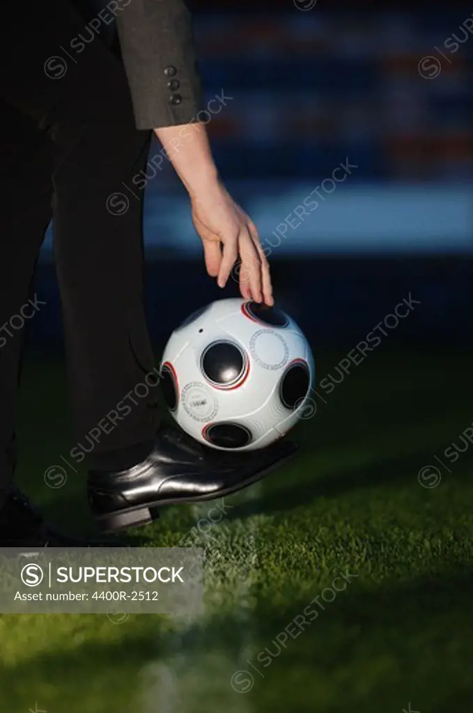 A black shoe and a football.