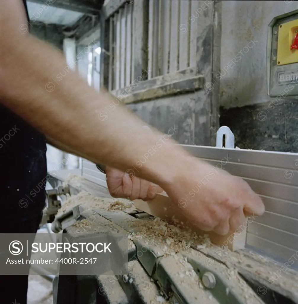 A man working with wood, Sweden.
