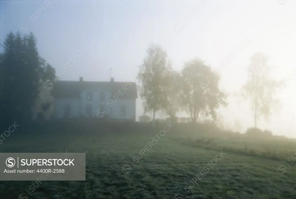 A white house in a hazy early morning, Sweden.
