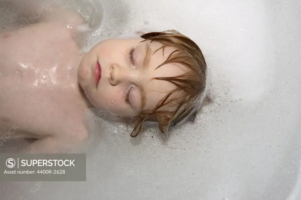 A boy in a bathtub, Sweden.