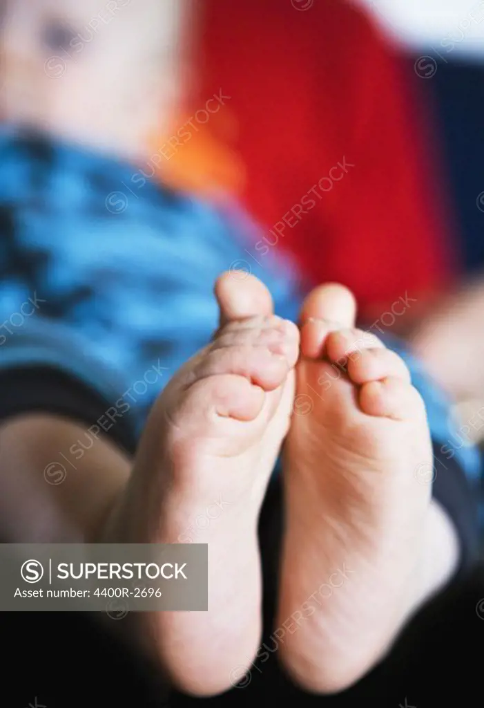 The feet of a child, close-up.