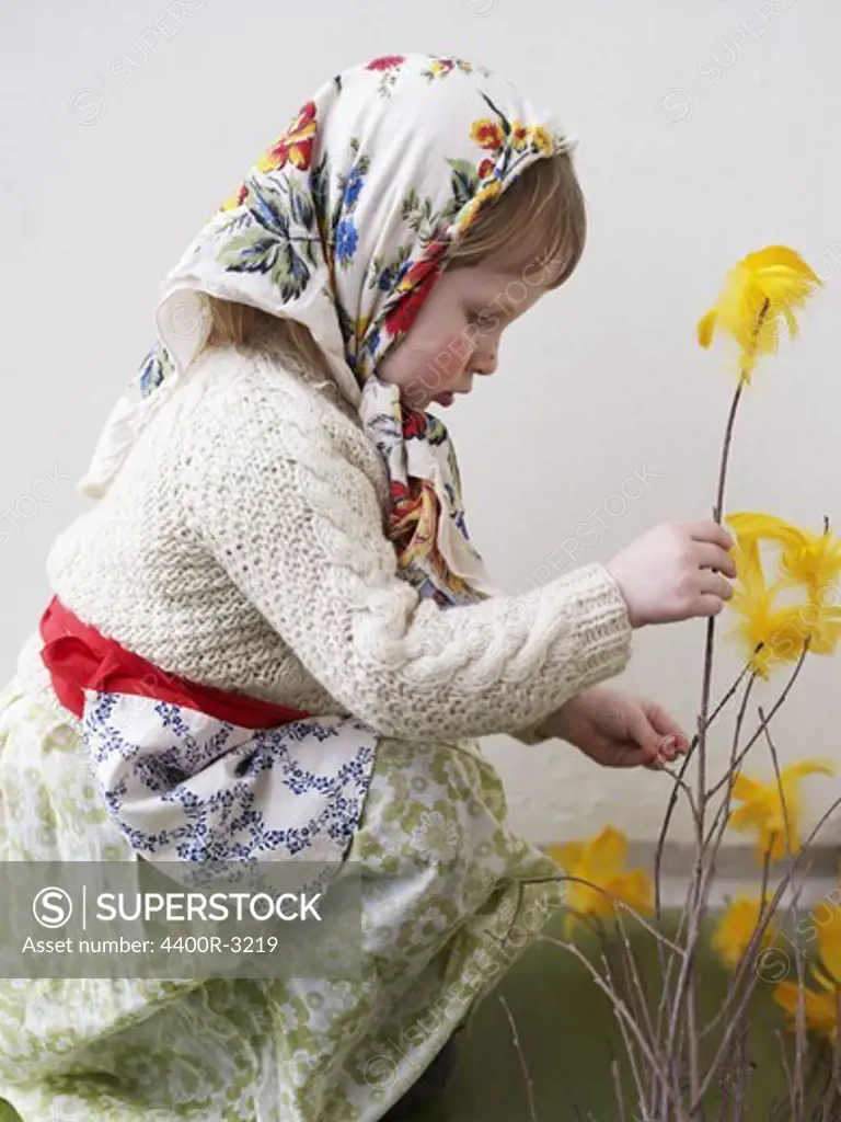 A young girl dressed up as an Easter witch, Sweden.