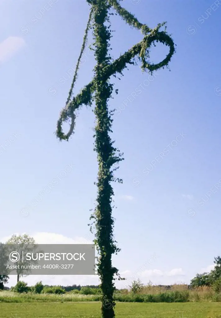 A maypole on a field, Sweden.