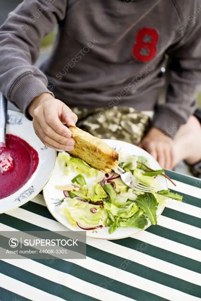 A boy eating dinner