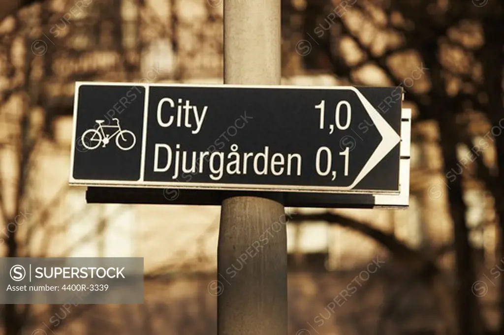 A sign pointing towards Djurgarden in Stockholm, Sweden.