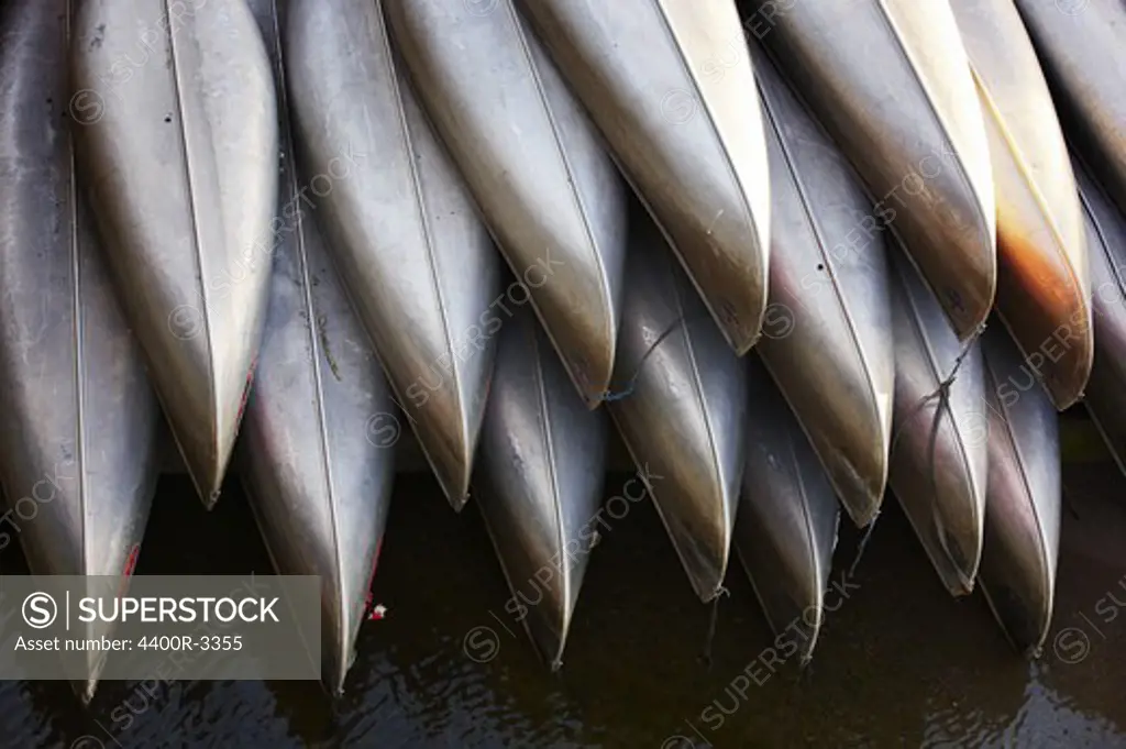 A pile of canoes.
