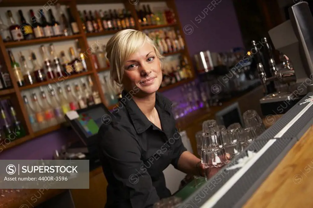 Young Scandinavian female bartender, Sweden.